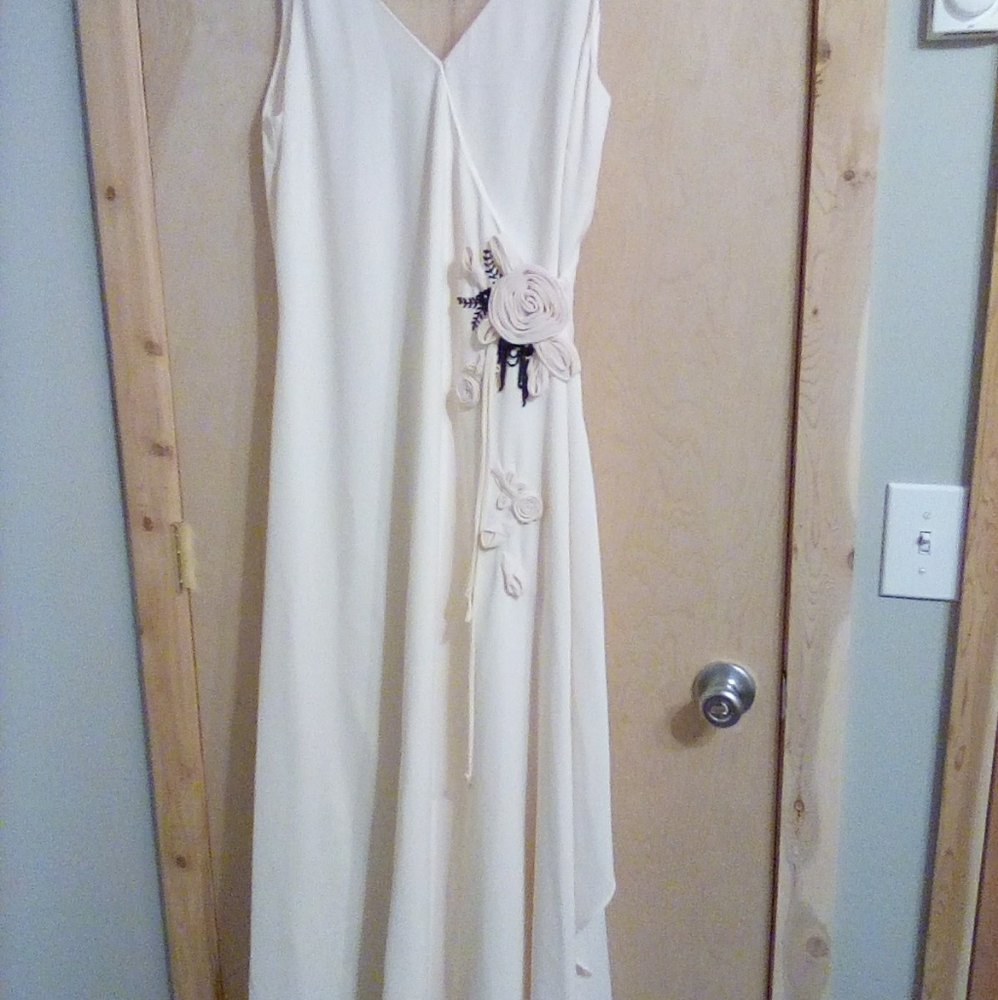 Bridesmaid dress size 14. Ivory with self fabric flowers as decoration .